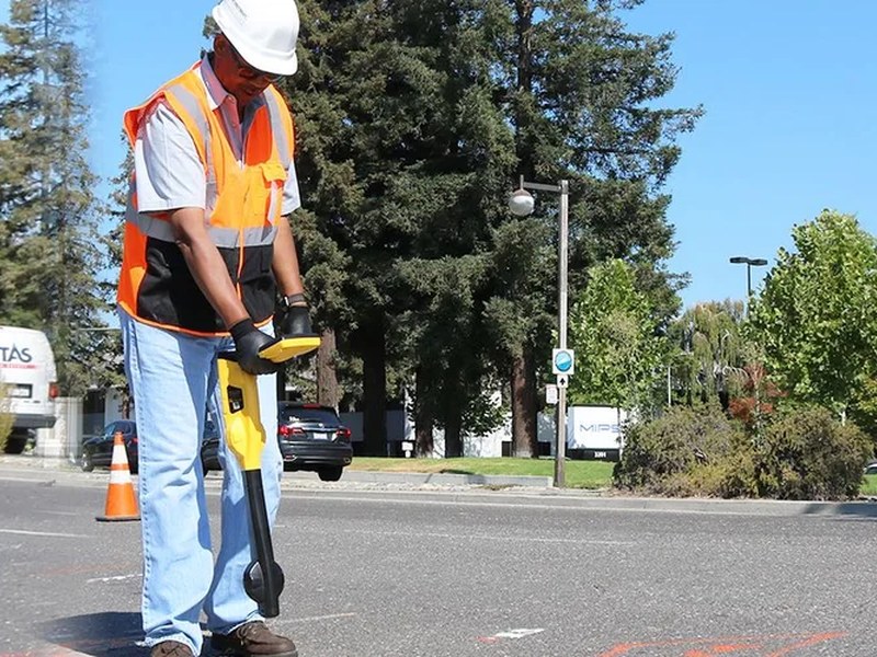 Utility locator being used for pipe and cable detection
